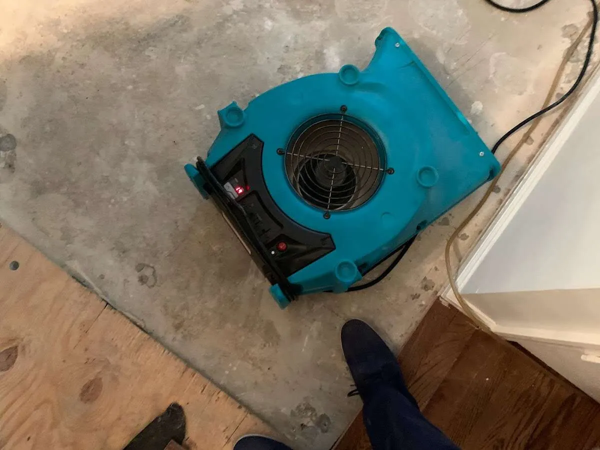 Air mover drying subfloor during Leak Detection & Repair in Medical Lake